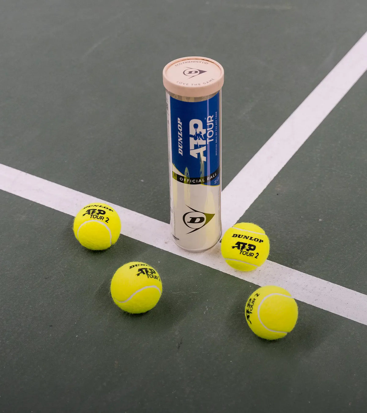 Dunlop ATP Tour tennis balls with a can on a tennis court